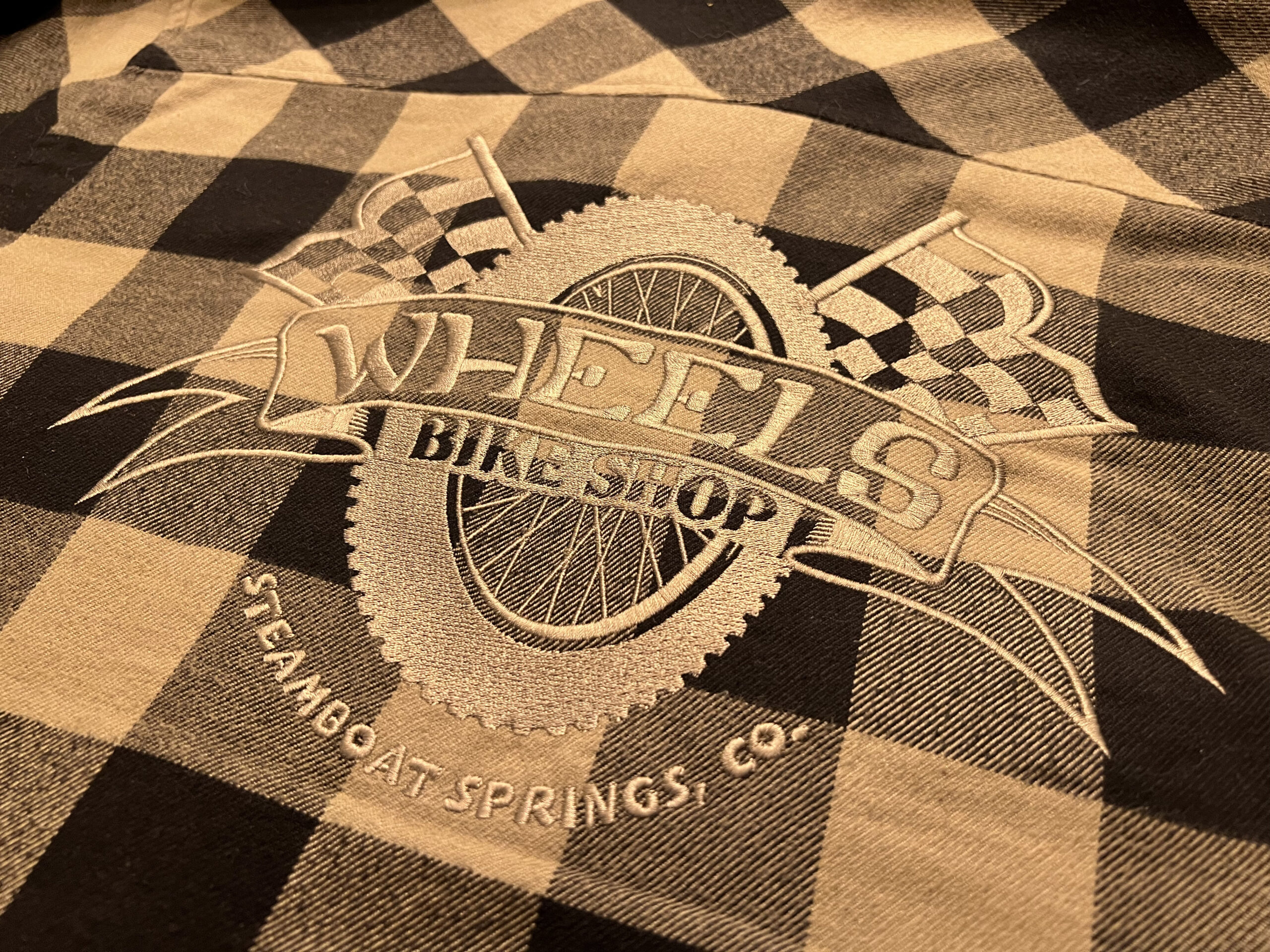 Wheels Bike Shop of Steamboat Springs CO. custom embroidered flannels